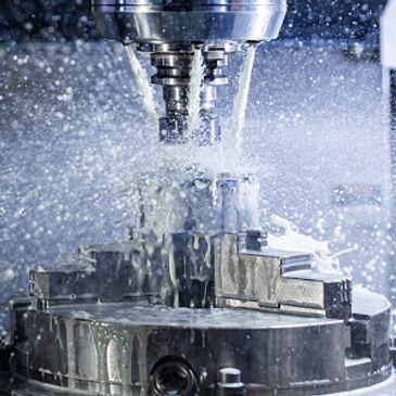 A CNC milling machine precisely fabricating a metal part with meticulous accuracy.